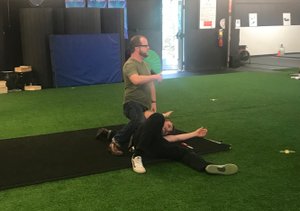 Instructor demonstrates a takedown